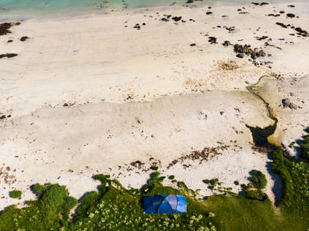 Blue tent on Gimsoysand sandy beach in summer. Camping on ocean shore. Lofoten archipelago Norway. Holidays and travel.の写真素材