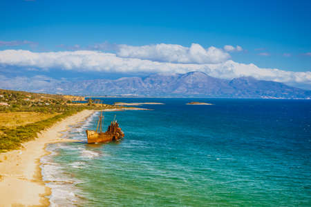 Greek coastline with the famous rusty shipwreck Dimitrios in Glyfada beach near Gytheio, Gythio Laconia Peloponnese Greece.の写真素材