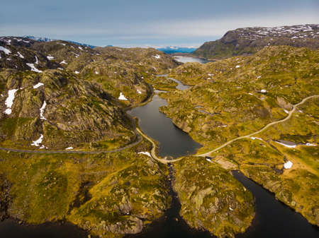 Aerial view. Norway landscape. Road and lakes in stony rocks mountains. Norwegian national tourist scenic route Ryfylke.の写真素材