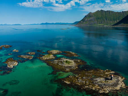 Seascape on Lofoten islands with Gimsoysand lighthouse, Gimsoya island, Nordland county Norway.の写真素材