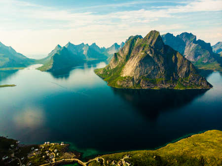 Scenic fjord landscape with Reine village, coast nature with sharp high mountain peaks, Lofoten islands North Norway. Travel destination.の写真素材