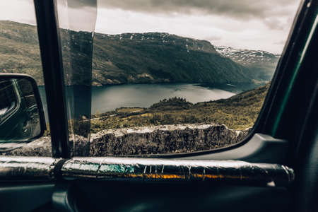 Tourism vacation and travel. Summer mountains fjord landscape, view from camper van window,...