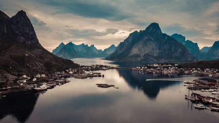 Scenic fjord landscape with Reine village, coast nature with sharp high mountain peaks, Lofoten islands North Norway. Travel destination.の写真素材