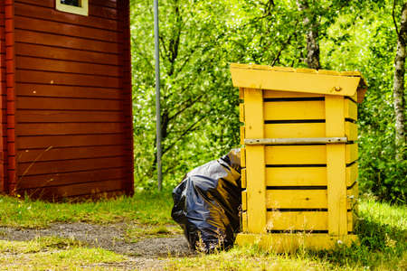 Picnic site rest stop area with garbage bin in norwegian nature. Scandinavia Europe.