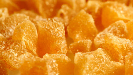 Close up heap of crystallized candied ginger pieces as foog background. Yummy snack, better...