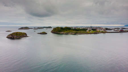 Lofoten landscape with road and bridge connecting the islands over the sea. Henningsvaer village Austvagoya island, Norway, overcast weather.の写真素材