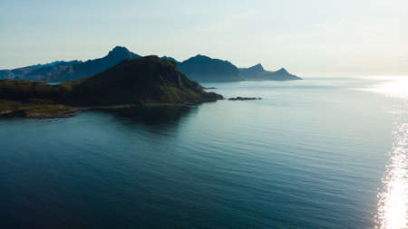 Coast of Vestvagoy island, Uttakleiv location. Seascape with scenic rocky shoreline and high mountains. Lofoten archipelago Northern Norway, Europe.の写真素材