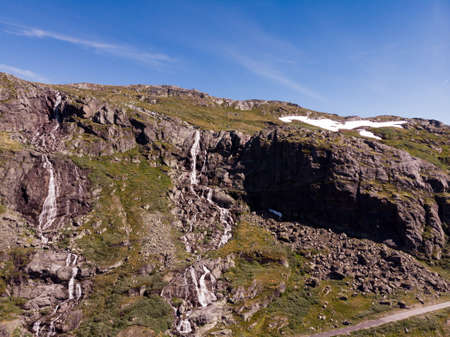 Waterfalls in mountains. National tourist scenic route 55 Sognefjellet between Lom and Luster, Norway. Summertime.の写真素材