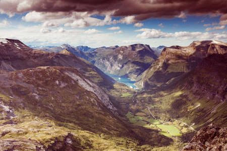 Tourism vacation and travel. Fantastic view on Geirangerfjord and mountains landscape from Dalsnibba viewpoint, Geiranger Skywalk platform, Norway.の写真素材