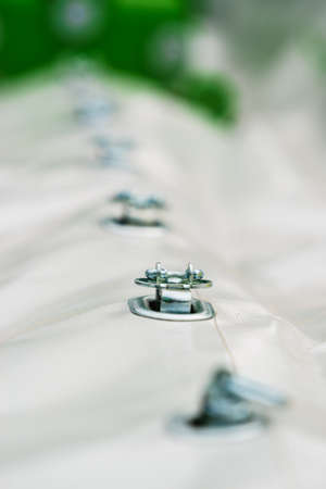 Close up of white party event tent details, hooks, , cord. Detailed objects concept.の写真素材