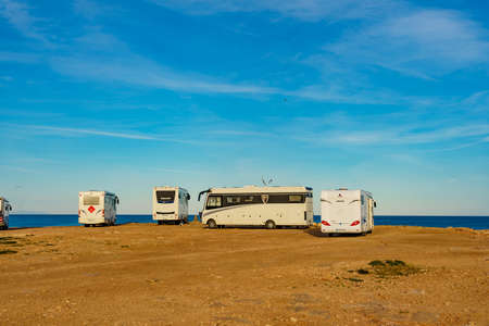 TORREVIEJA, SPAIN - JANUAR 30, 2019: Campers, motorhomes and recreational vehicles on mediterranean coast of Torrevieja seaside spanish city on the Costa Blanca, on Januar 30, 2019, Spainのeditorial素材