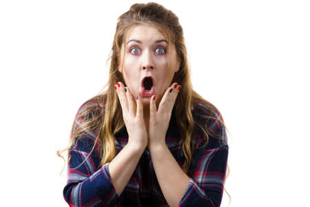 Amazed astonished young woman being suprised or shocked by something. Female having shock face...
