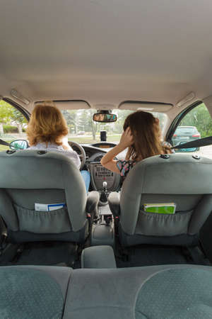 Man and woman during traveling trip. Couple, friends sitting inside vehicle car driving riding...
