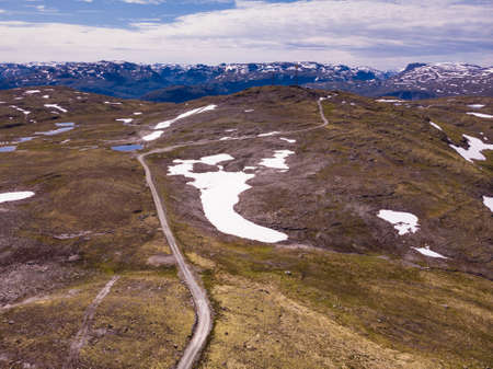 Mountain region between Aurland and Laerdal in Norway. Rocky landscape with road. National tourist...