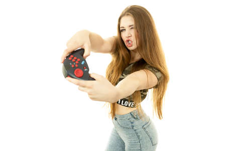 Nerd geek young adult women playing on the video console holding game pad. Gaming gamers concept.の写真素材