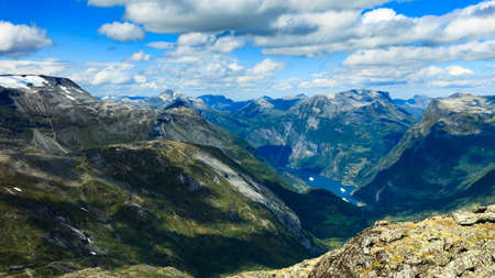 Tourism vacation and travel. Fantastic view on Geirangerfjord and mountains landscape from Dalsnibba viewpoint, Geiranger Skywalk platform, Norway.の写真素材