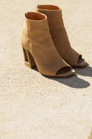 Brown suede shoes boot in autumnal style. Boots with high heels and peep toesの写真素材