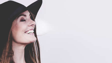 Fashion looks elegance clothing headwear concept. Gorgoeus lady smiling. Young blonde girl wearing...