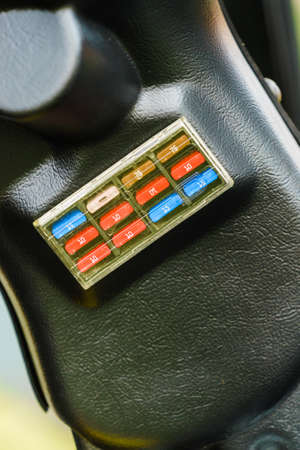 Close up of car fuse box in auto truck tractor machine vehicle. Electronics in transportation.