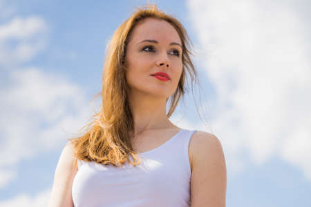 Long hair young woman portrait outdoor at sunny day