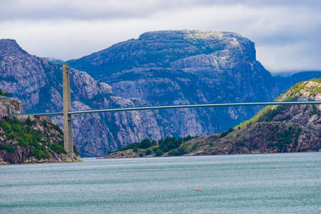Fjord landscape. suspension bridge over Lysefjord. National tourist route Ryfylke. Vacation and...