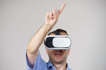 Business man wearing virtual reality goggles headset, vr box. Connection, technology, new generation...
