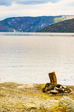 Bonfire and fjord landscape near Erdal village in Norway, Scandinavia Europe. Tourism vacation and...