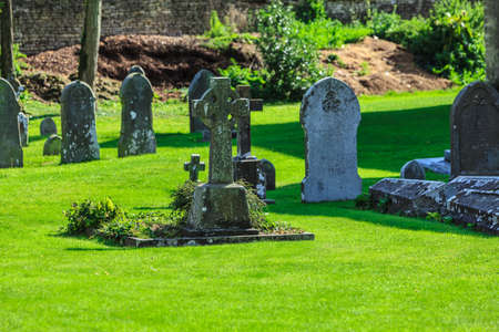 BIBURY, ENGLAND, UK - SEPTEMBER 21, 2014: graveyard in St Mary Parish Church in Bibury in Cotswold...