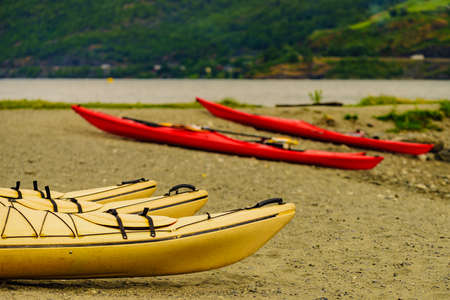 Kayaks on fjord shore in norwegian tourist destination Flam village. Travel, holidays and active lifestyle.の写真素材