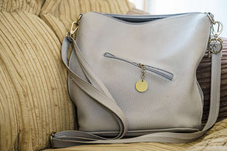 Gray big purse bag with zipper on front. Fashion, clothing details concept.の写真素材