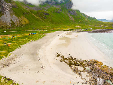Sea coast and Skagsanden Beach on Flakstadoy in summer. Nordland county, Lofoten archipelago Norway....