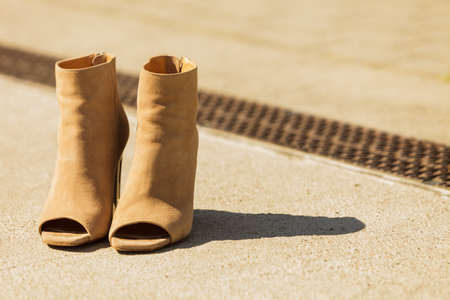 Brown suede shoes boot in autumnal style. Boots with high heels and peep toesの写真素材