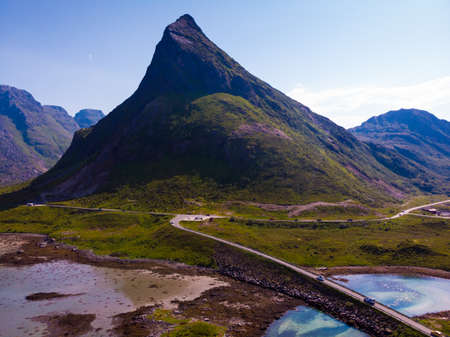 Norwegian scenic landscape on Lofoten archipelago. Road trough islands and sea. National tourist...
