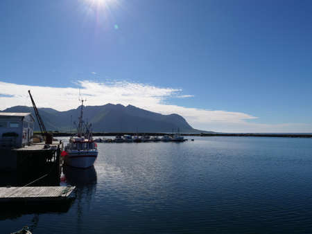 Scenic seascape with fishing port at Hovsund village, Gimsoya Lofoten Islands in Norwayの写真素材
