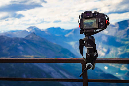 DALSNIBBA, NORWAY - JULY 30, 2018: Digital camera Panasonic Lumix GH5 take photo from Geiranger fjord and mountains landscape from Dalsnibba mountain viewpoint.のeditorial素材