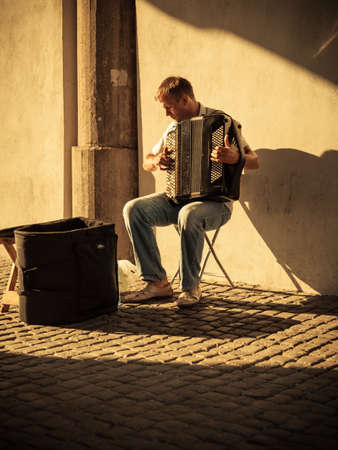 GDANSK, POLAND - 2010, July 21 : street musican playing the accordion in Green Gate (Brama Zielona)...