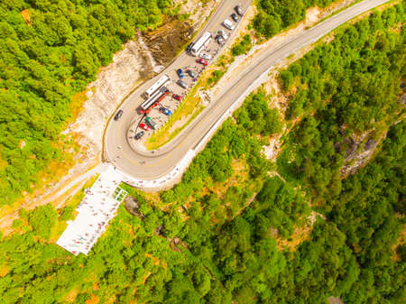 Top down view. Ornesvingen viewing point, platform with parking area and tourist road Ornevegen....