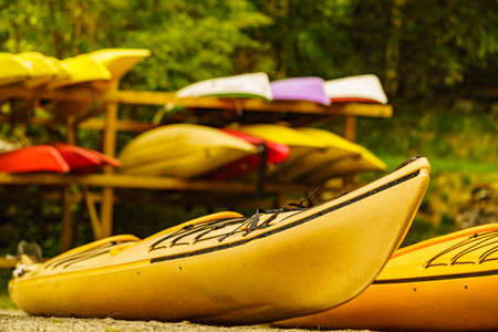 Kayaks on water shore. Rental centre. Travel, holidays and active lifestyle.の写真素材