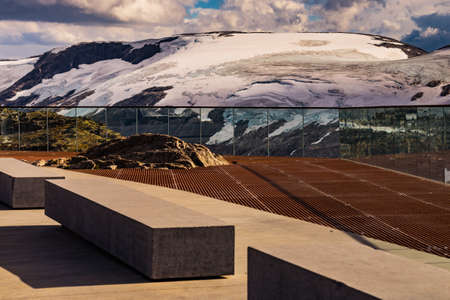 Fantastic view on mountains landscape from Dalsnibba viewpoint, Geiranger Skywalk platform floor surface and rest benches, Norway.の写真素材