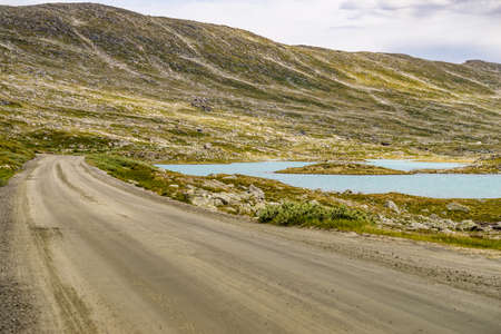 Mountains landscape and old road, national tourist scenic route Gamle Strynefjellsvegen, Southern Norway. Travel and adventure.の写真素材