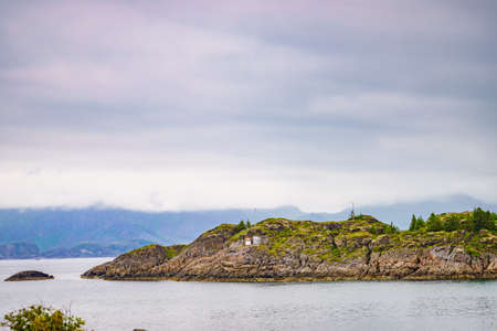 Sea landscape with stone isles on fjord Vjestfjord, Lofoten islands, Henningsvaer region, Norway....