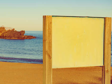 Tourism holidays and travel. Empty board on beach in Spain