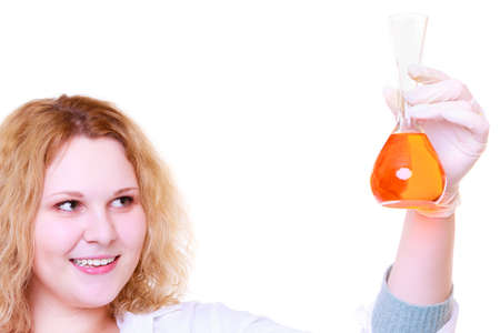 Chemist woman, girl student, female laboratory assistant or scientific researcher with chemical glassware test flask. Experiment, research in progress, isolated on whiteの写真素材