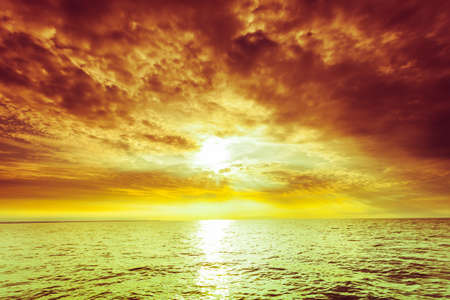 Colorful sunset over evening sea horizon, clouds sky. Tranquil scene. Natural background. Landscape. View from yachtの写真素材