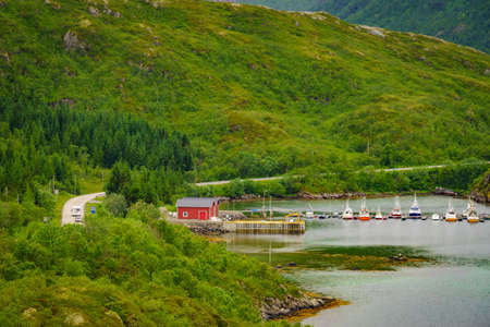 Lofoten fjord landscape, marina dock basin with moorings fishing boats, Norwayの写真素材