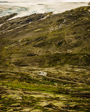 Camper in norwegian mountains. Camping on nature. Traveling, holidays and adventure concept.の写真素材
