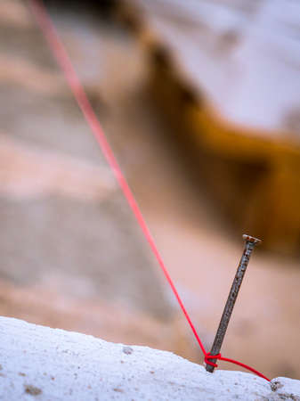 String being used as level in the construction of wall. Bricklayerの写真素材