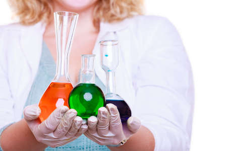 Science and education. Scientist at school laboratory. Girl with many chemical beakers. Student with...