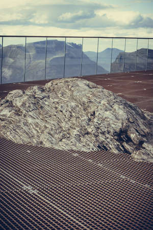 Fantastic view on mountains landscape from Dalsnibba viewpoint, Geiranger Skywalk platform floor surface and natural rock, Norway.の写真素材