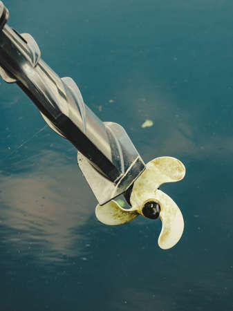 Propeller of boat on sea coast. Nautical vessel sailing concept.